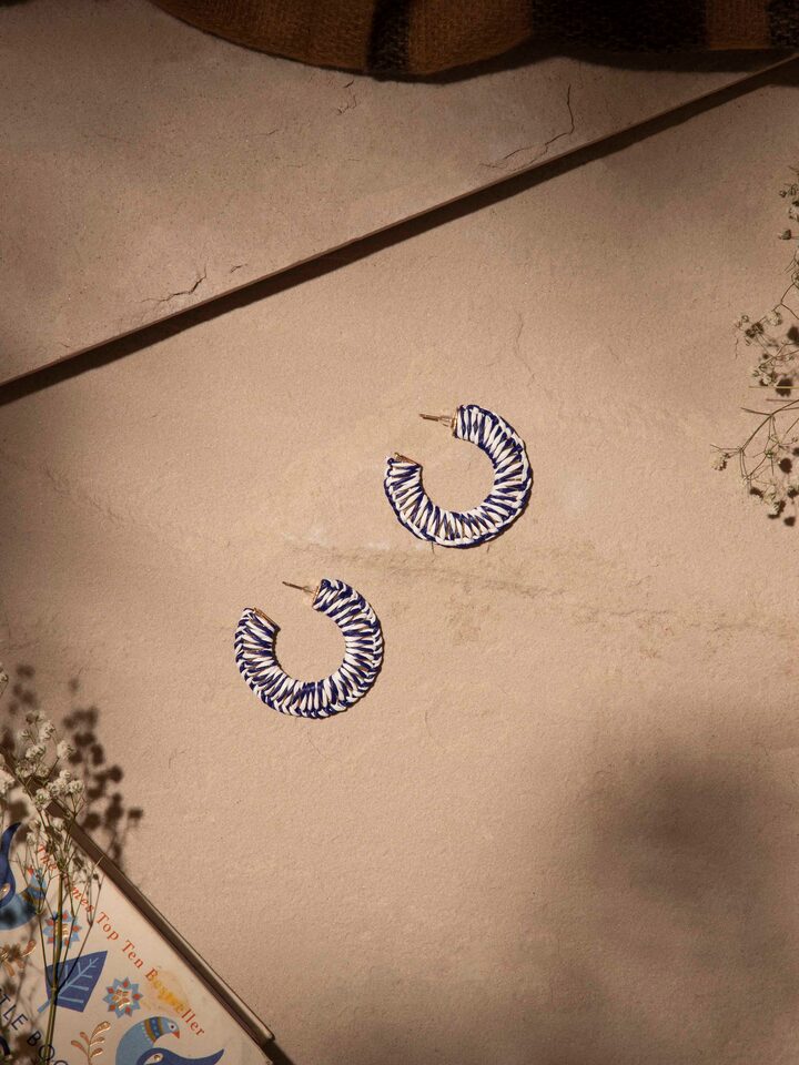 Close-up view of Handcrafted Hoop Earrings featuring fine metal detailing and elegant hoop design.