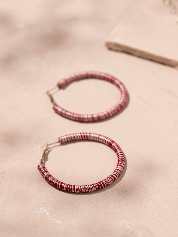 Detailed view of Handcrafted Hoop Earrings from a distance to showcase their full design.