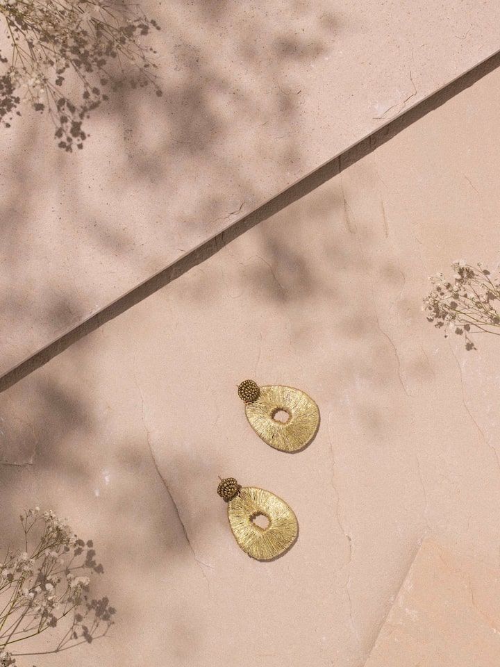 Side view of Handcrafted Drop Earrings showcasing their elegant design.