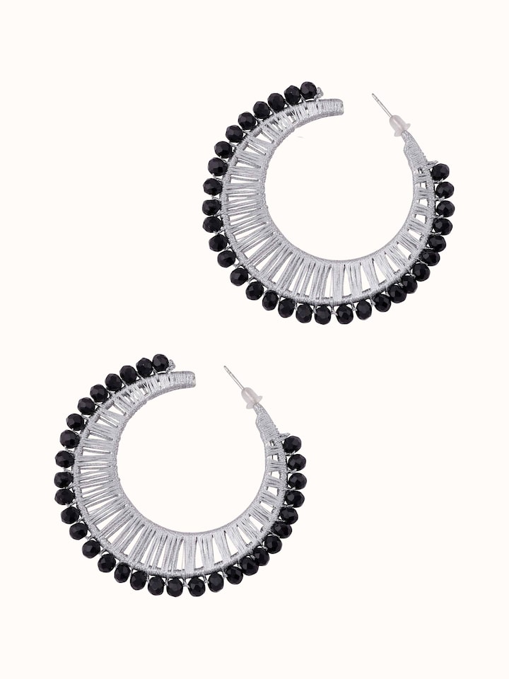 Angled view of Handcrafted Hoop Earrings showcasing the hoop design and overall elegance.