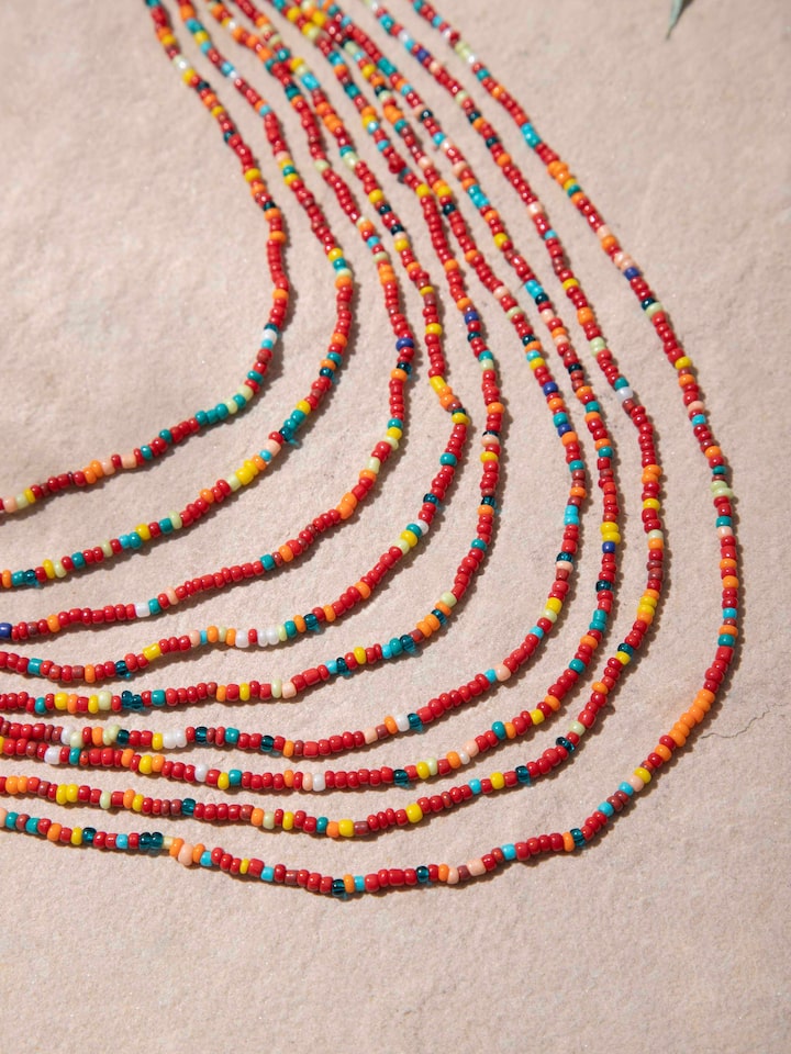 Angled view of handcrafted collar necklace showcasing its sophisticated design and elegant finish