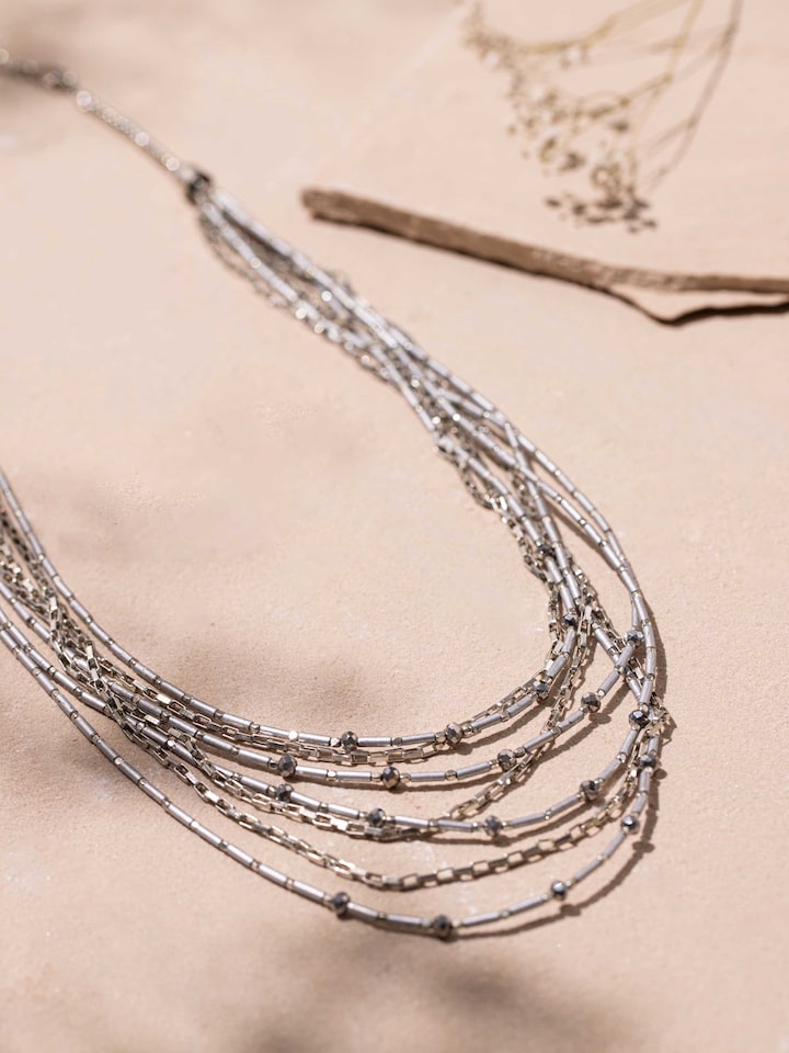 Detailed close-up of handcrafted collar necklace showcasing its ornate design and detailed craftsmanship