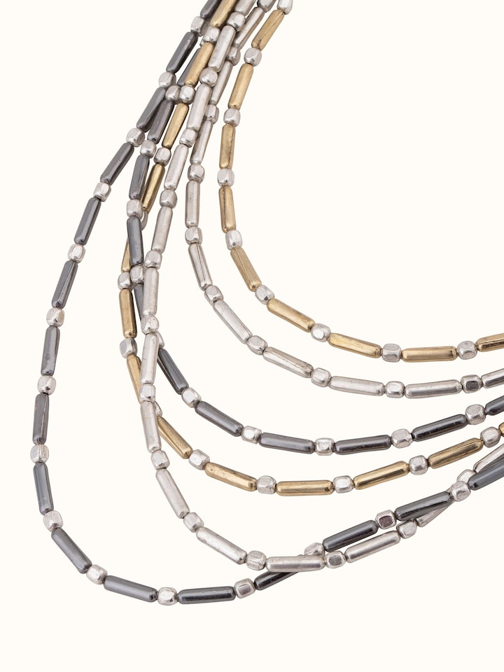 Angled view of handcrafted collar necklace showcasing its sophisticated and stylish appearance