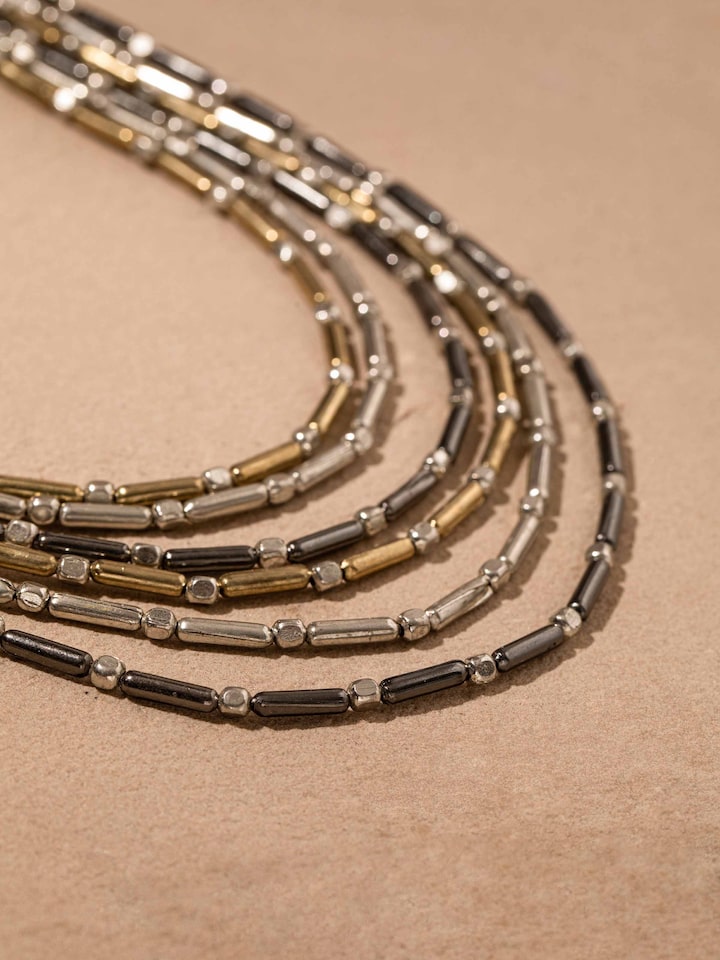 Detailed front view of handcrafted collar necklace highlighting its unique and artistic design