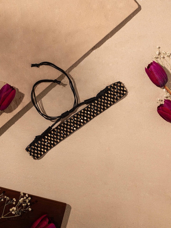 Side view of handcrafted choker emphasizing its detailed design.