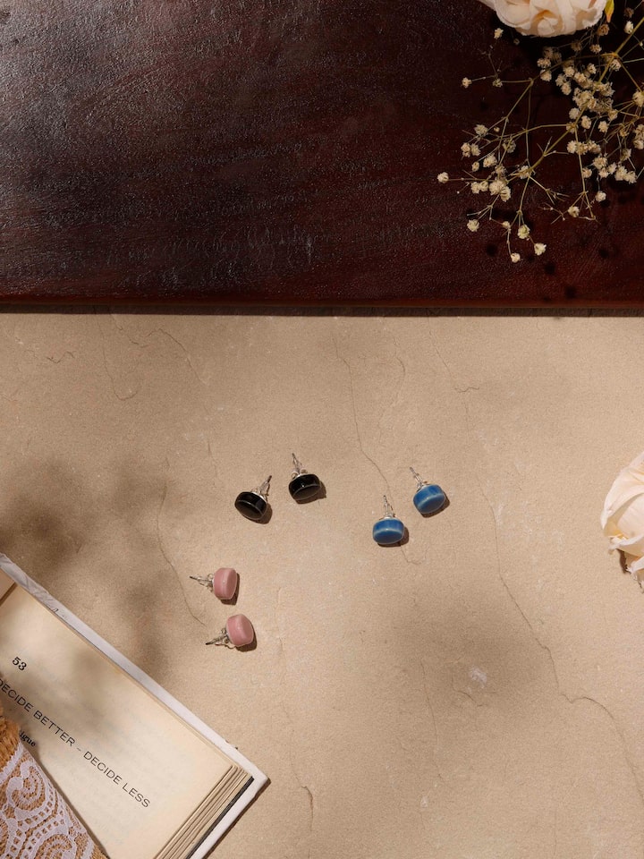 Styled detail view of Ceramic Stud Earrings Set worn on the ear, shown in an alternate styled shot