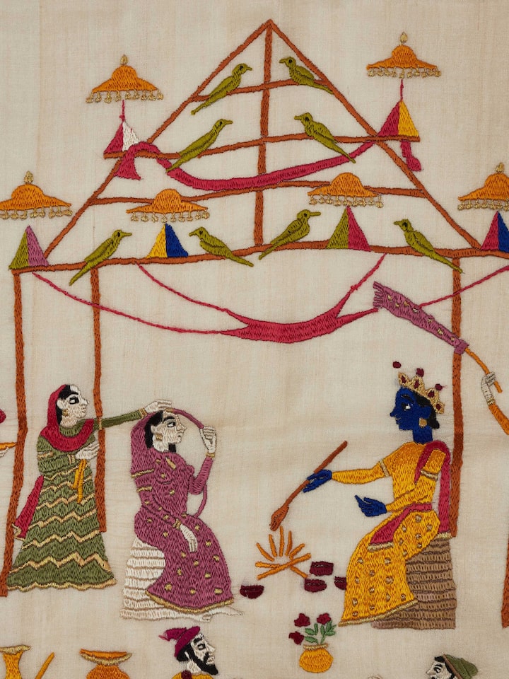 Close-up view of Chamba rumal vidhi wall art emphasizing the fine details and vibrant stitching.