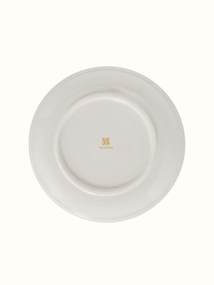 Angled view of Khurja Pottery Ceramic Dinner Plates in Orange & White showcasing design details.