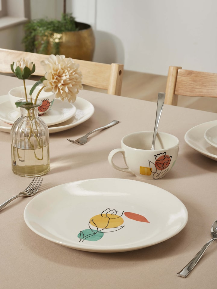 Side view of Khurja Pottery Ceramic Dinner Plates in Orange & White highlighting elegant design.