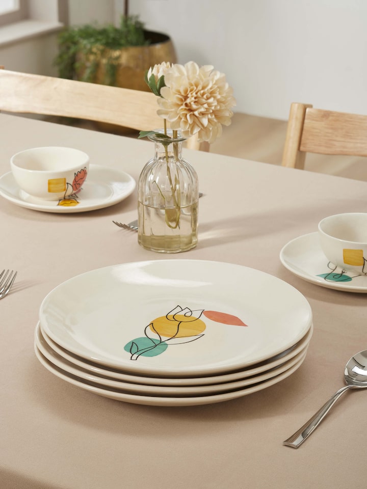 Detailed view of Khurja Pottery Ceramic Dinner Plates in Orange & White emphasizing craftsmanship.