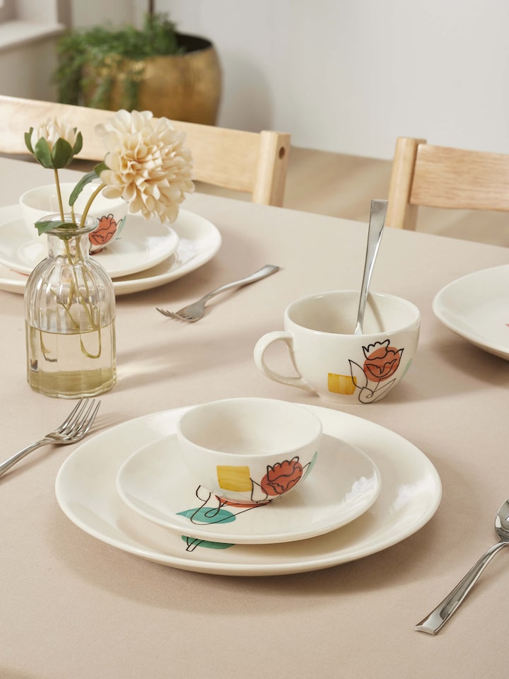 Close-up of Khurja Pottery Ceramic Dinner Plates in Orange & White showcasing detailed patterns.