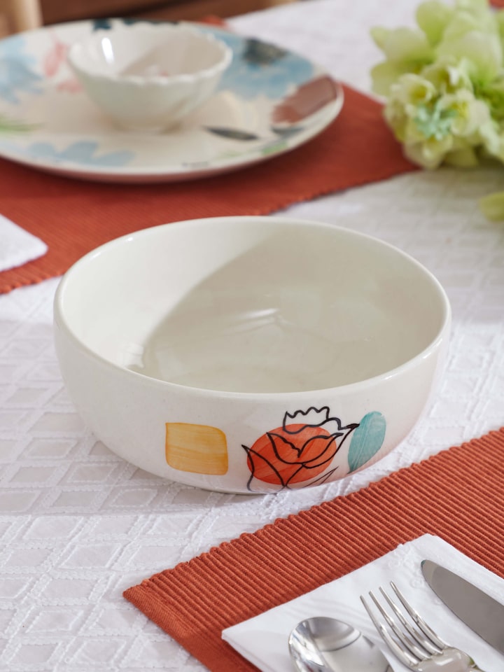 Side view of Khurja pottery ceramic serving bowl in orange & white showing detailed craftsmanship