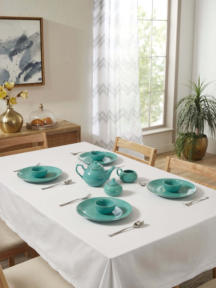 Angled view of Khurja Pottery Ceramic Dinner Plates Aqua (4 pcs) emphasizing the artistic craftsmanship and quality of ceramics.