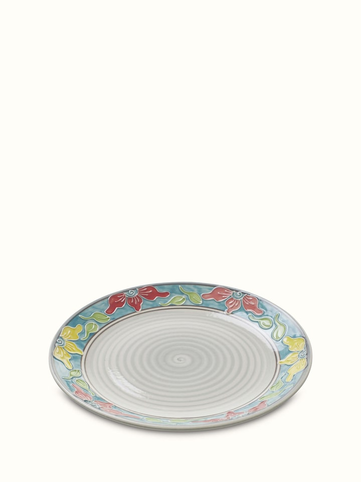Detailed view of Khurja pottery ceramic dinner plates with blue and white patterns, emphasizing the craftsmanship, Swadesh