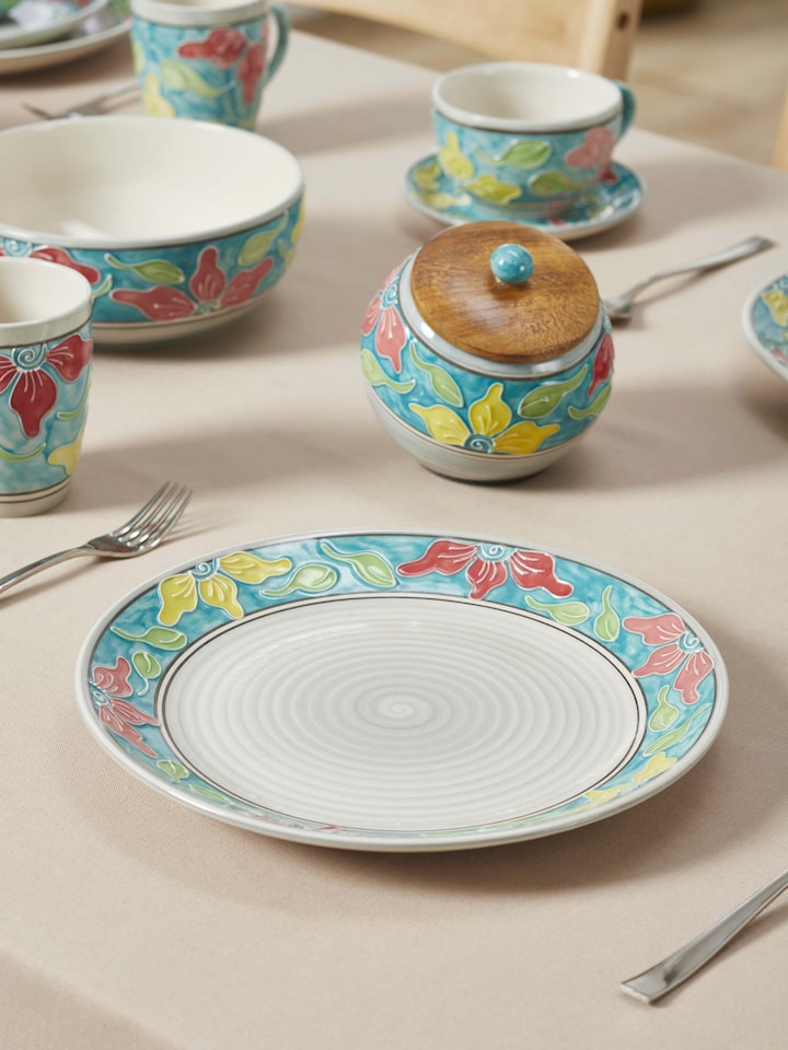 Top view of Khurja pottery ceramic dinner plates set, highlighting the detailed blue and white artwork, Swadesh