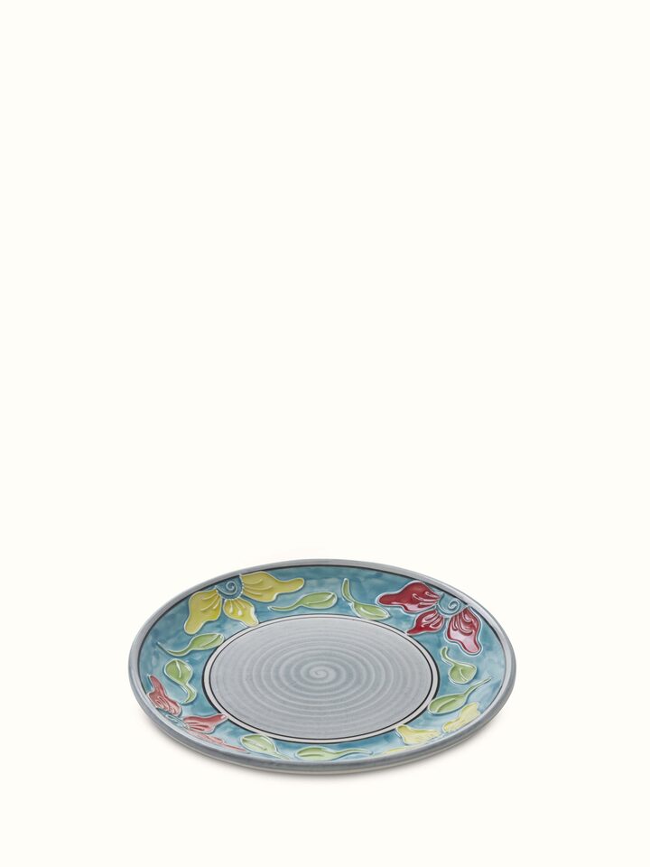 Angled view of Khurja pottery ceramic salad plates in blue & white, set of 4, emphasizing the unique patterns and design.