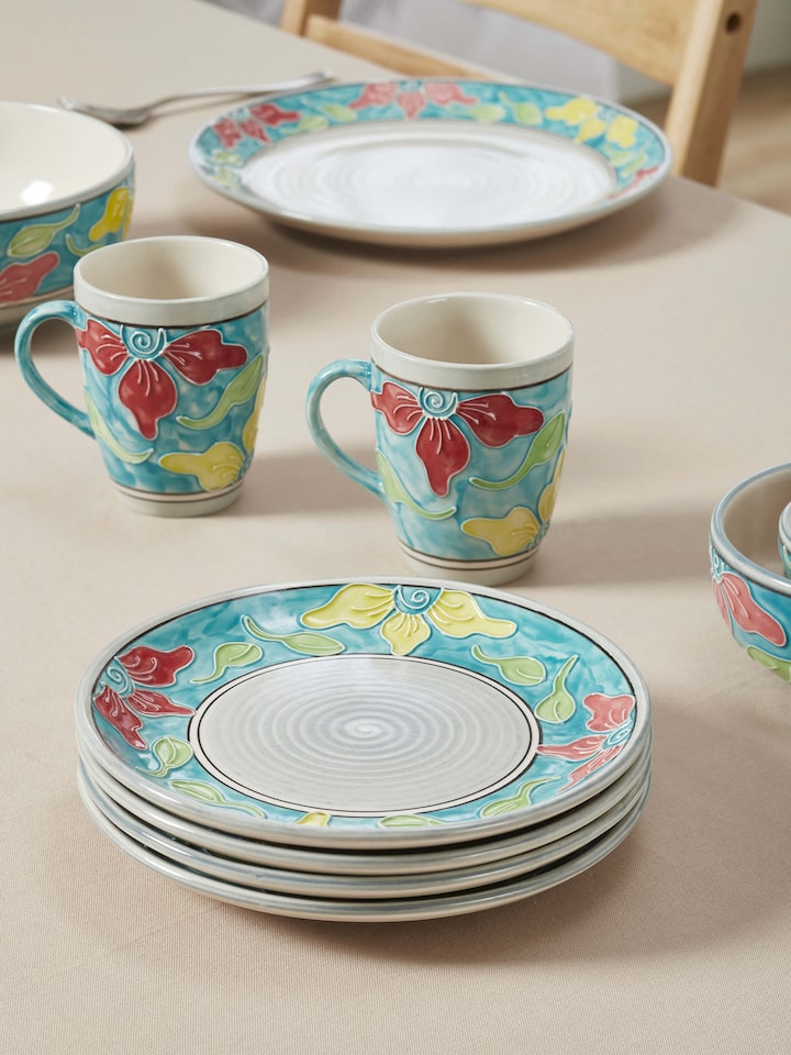 Close-up view of Khurja pottery ceramic salad plates in blue & white, set of 4, focusing on the intricate detailing.
