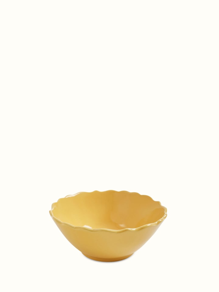 Front view of Khurja pottery ceramic serving bowl in yellow, showcasing its traditional design and color.