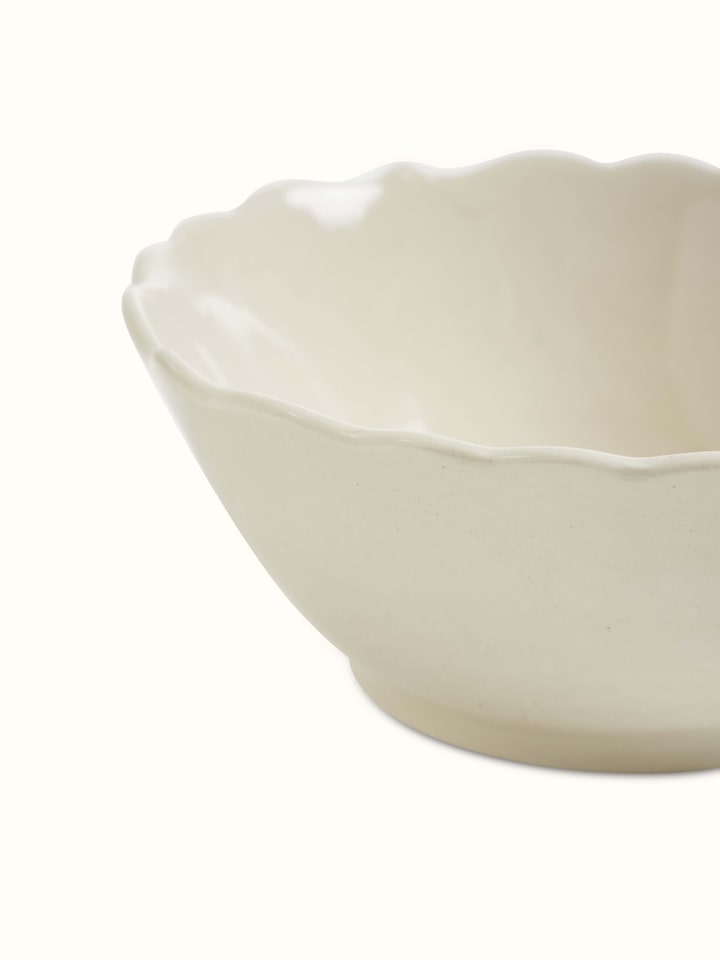 Angle view of Khurja pottery ceramic serving bowl in plain white.