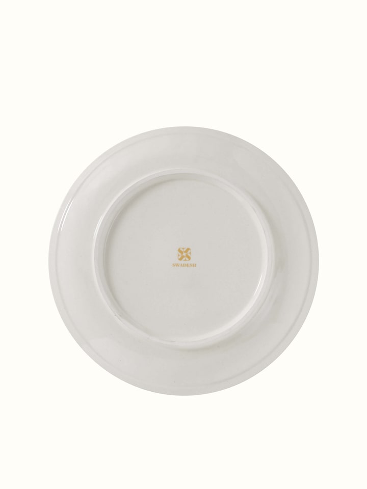 Angled view of Khurja pottery ceramic dinner plates (4 pcs) emphasizing their traditional patterns