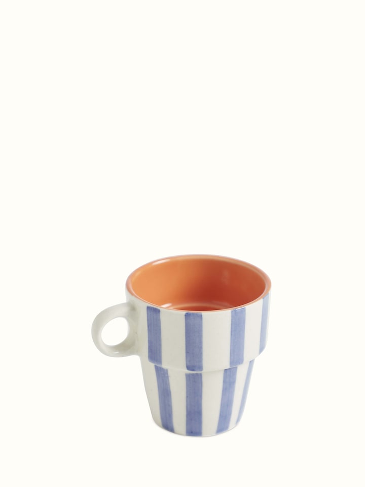 Angled view of Khurja pottery ceramic coffee mugs in blue & white (4 pcs) emphasizing the classic design and craftsmanship.