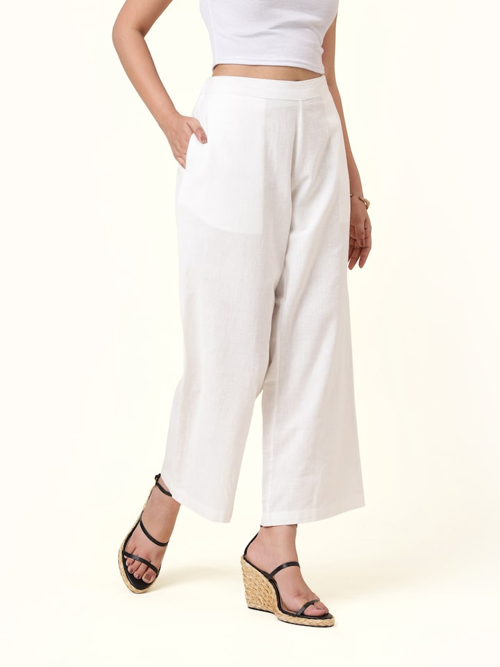 Front view of white cotton hand-spun palazzos showcasing relaxed silhouette and breathable fabric