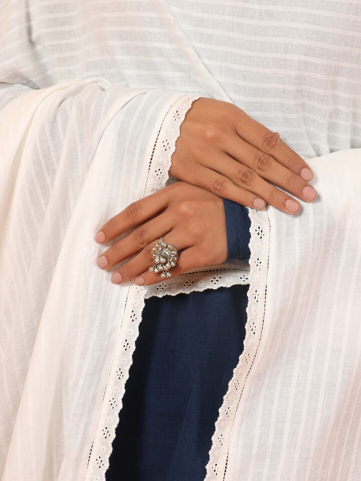 Angled view of white cotton hand-spun dupatta showing subtle weave and breathable fabric.