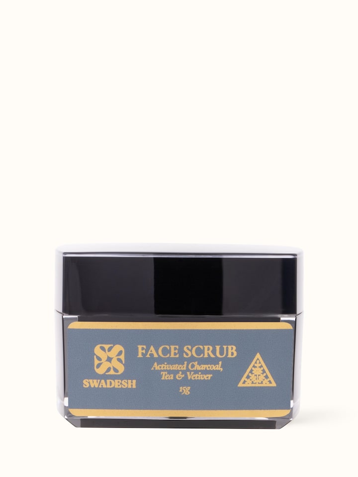 Front view of Face Scrub Activated Charcoal, Tea & Vetiver highlighting the container's design and product label.
