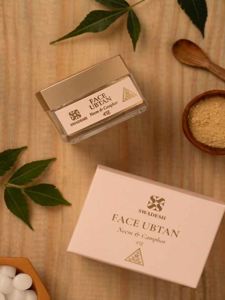 Side view of Face Ubtan Neem & Camphor displaying the product label and key benefits