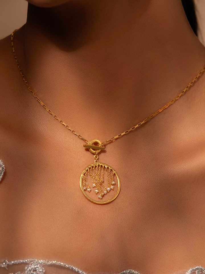 Styled detail view of Silver Smithing Long Necklace worn around the neck, shown in another styled shot
