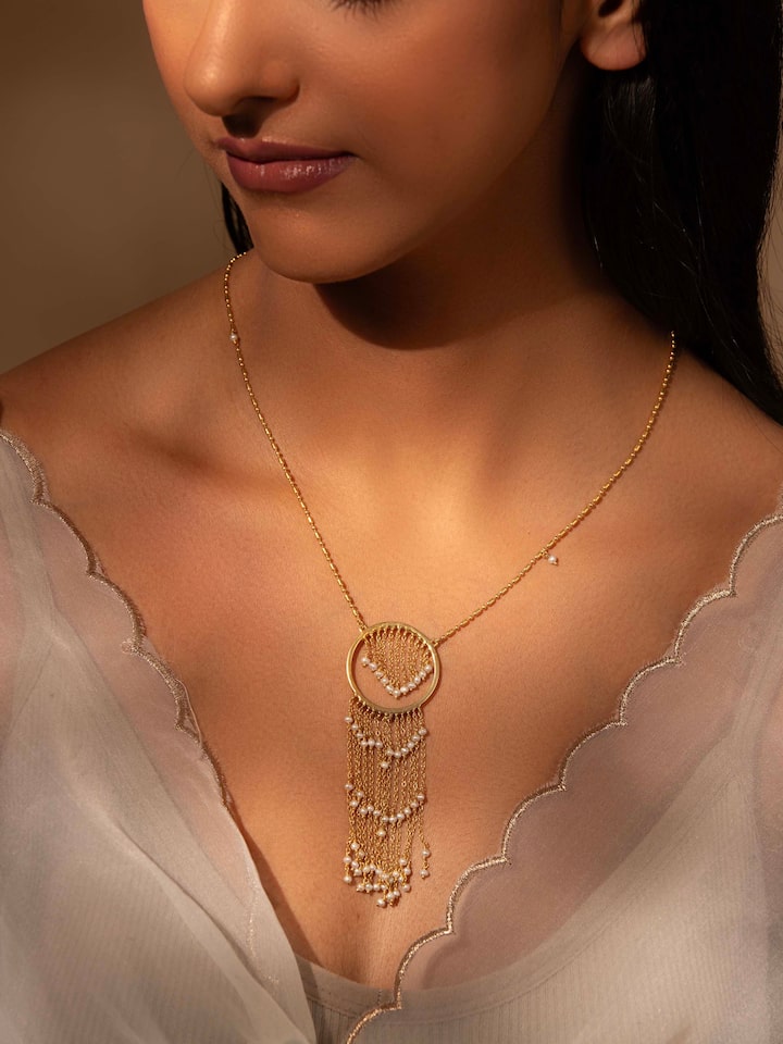 Side view of Silver Smithing Long Necklace highlighting the detailed silver work and elegant design.
