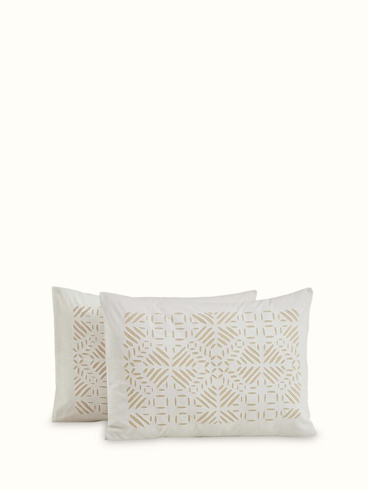 Close-up of Jharokha Beige Trellis Cotton Appliqué King Bedspread Set highlighting the appliqué design and texture.