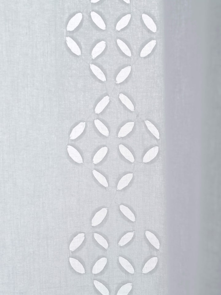 Mandana sheer curtain with a white trellis stripe and applique design, demonstrating the curtain’s light and airy quality.