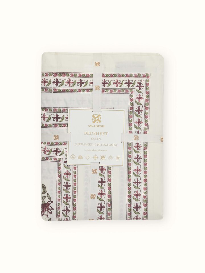 Detailed view of the Aarunya red buta cotton Sanganeri block printed queen bedsheet set, showcasing the pattern and stitching.
