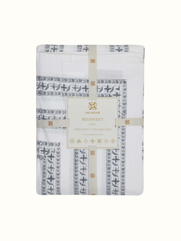 Aarunya grey buta cotton Sanganeri block printed bedsheet set (3 pcs) - Displaying the bedsheet and pillow covers arranged on a bed