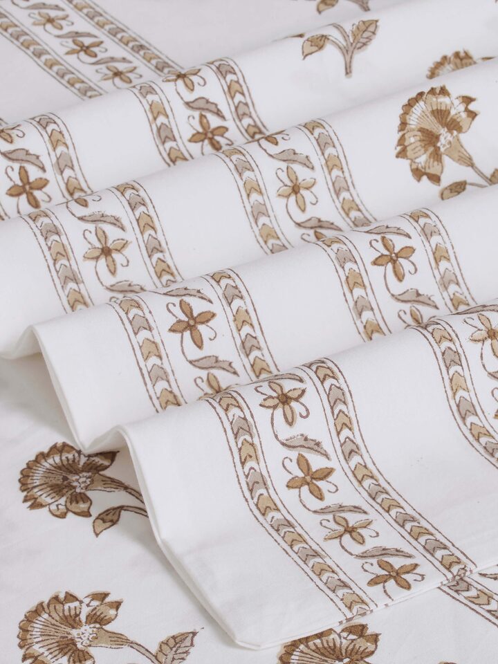 Detailed view of Aarunya beige buti cotton Sanganeri block printed king bedsheet set, highlighting the texture and print details.