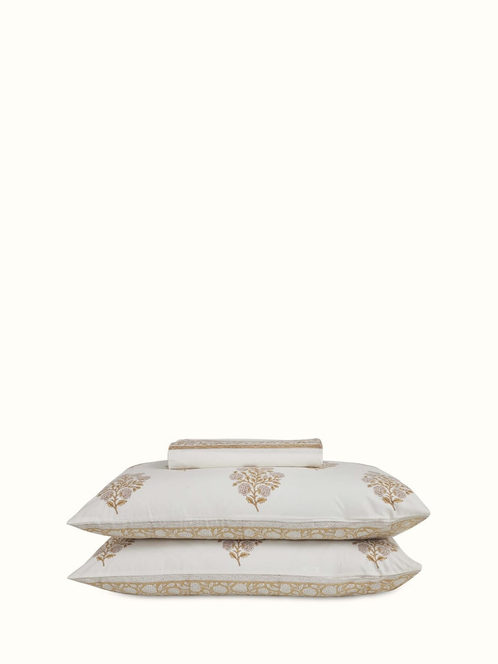 Detailed shot of a brown floral cotton Sanganeri block printed king bedsheet, focusing on the intricate floral patterns.