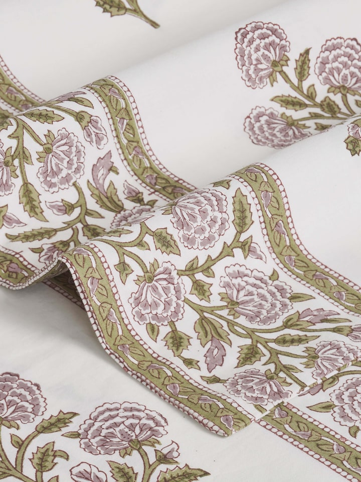 Folded queen bedsheet set featuring lavender buta Sanganeri block print, highlighting the fabric’s design and color