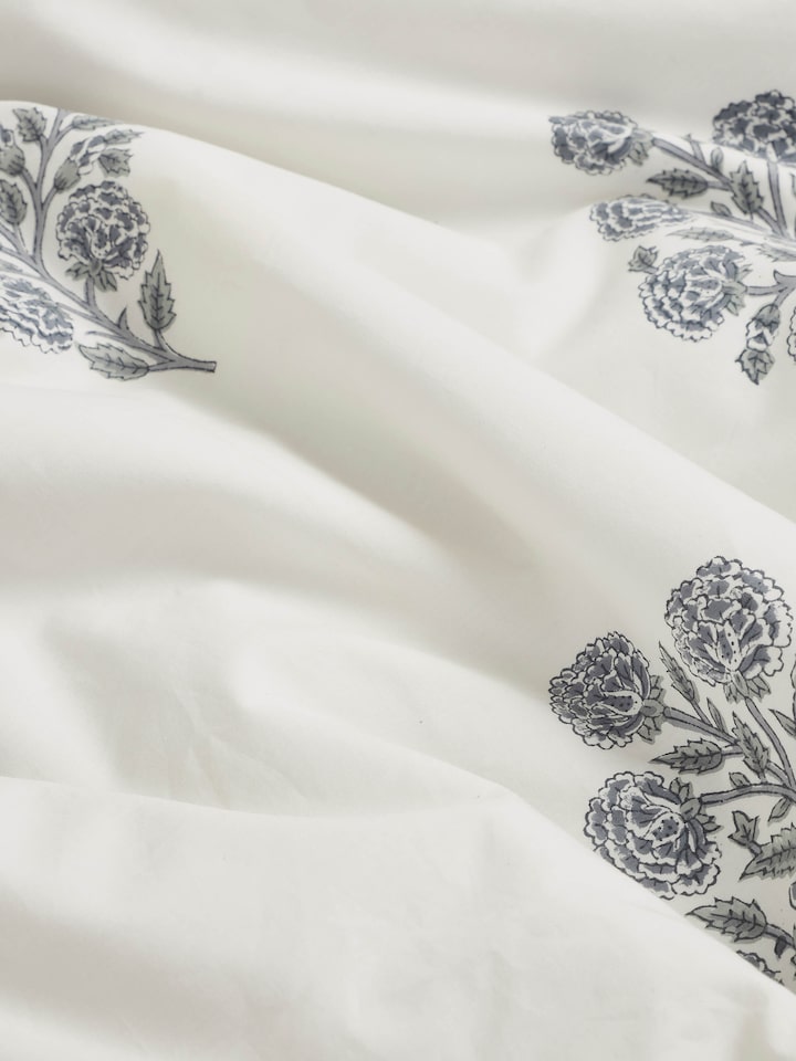 Saha grey buta stripe cotton Sanganeri block printed queen duvet cover on a bed, displaying its design and functionality.