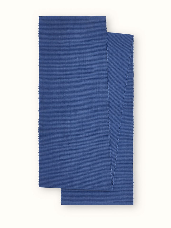 Front view of indigo cotton handloom table runner in minimalist solid finish.