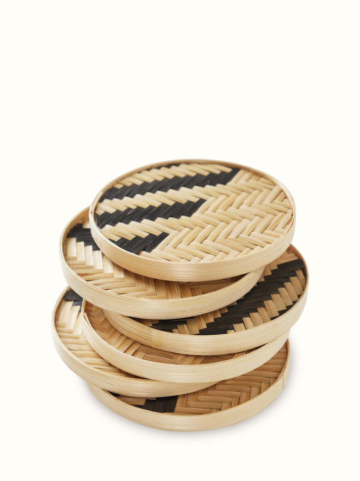 Detailed view of Naveena Grey Checks Round Natural Fibre Coasters, focusing on the intricate pattern and round shape.