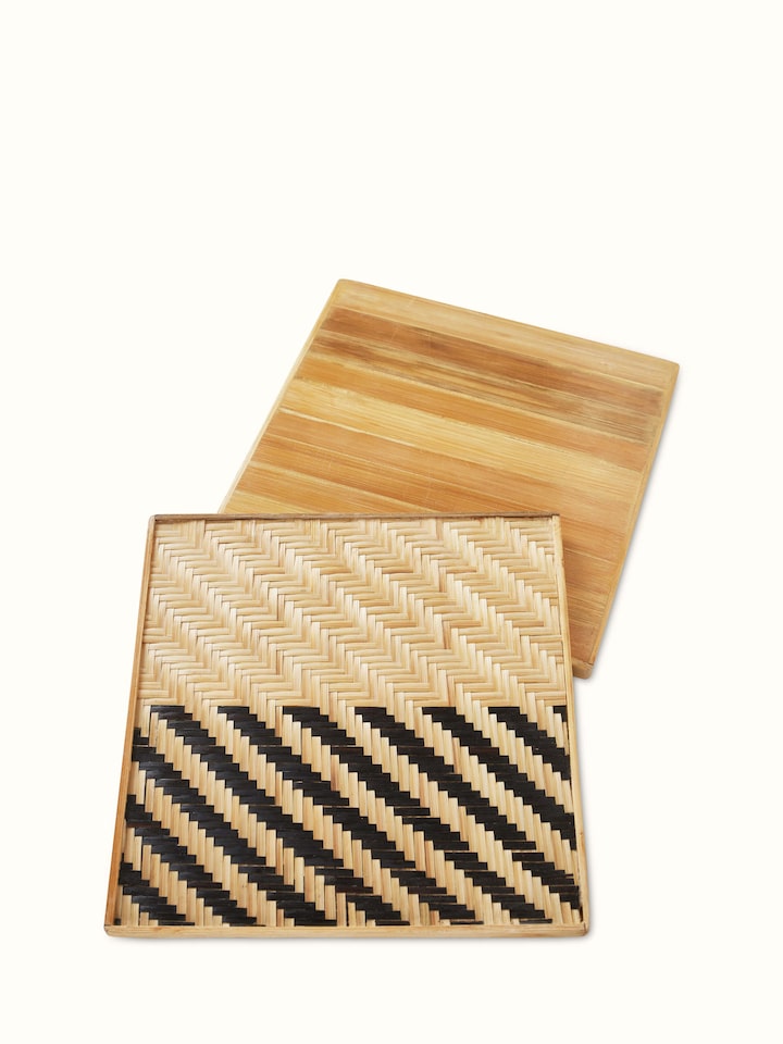 Close-up of Naveena grey geometric square natural fibre trivets (2 pcs) focusing on the natural fiber texture and geometric patterns