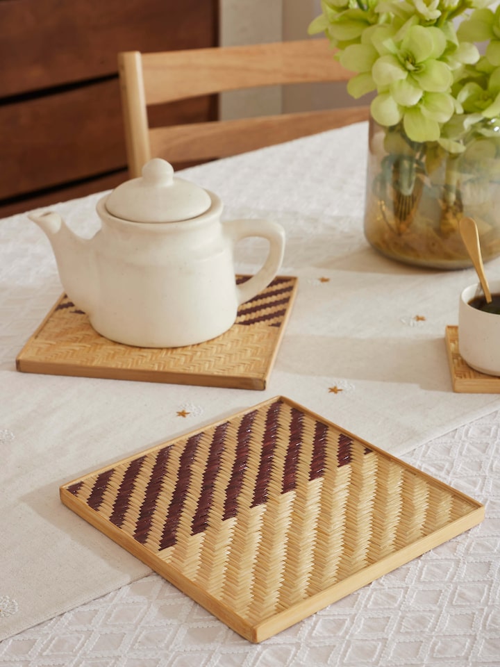 Side view of Naveena brown geometric square natural fibre trivets (2 pcs) showing the textured geometric design and natural fibre material.