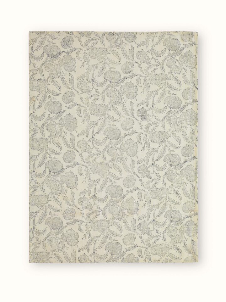 Samaha grey floral dish towels folded and stacked, emphasizing the block print pattern and the set of four.