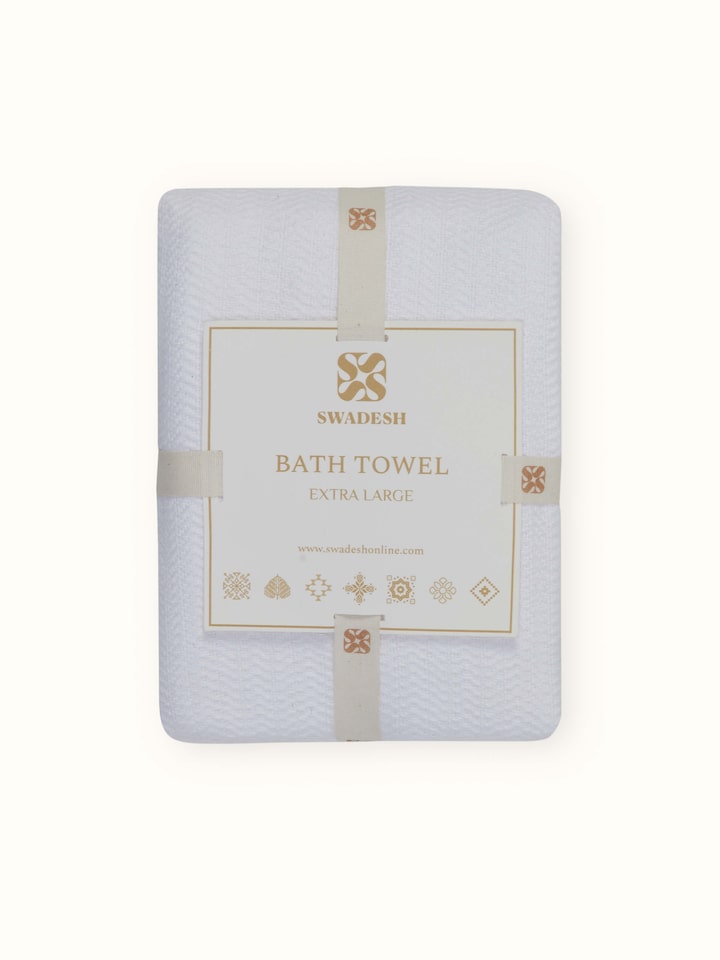 Perspective view of Vayana stripe white cotton bath towel (XL) capturing its large size and striped pattern.