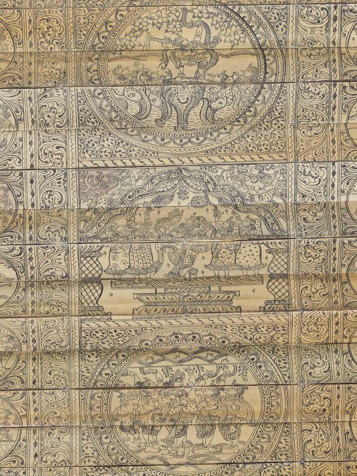 Detailed view of Palm leaf engraved lord Krishna narrative wall art showing intricate design