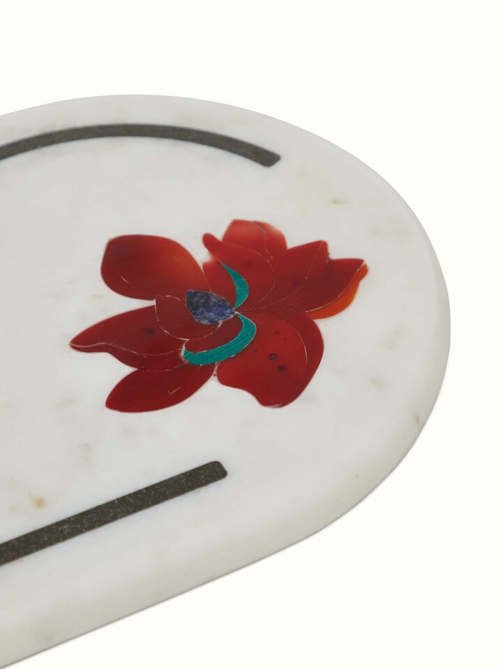 Close-up view of Marble & coloured stone cheese board highlighting the detailed stone patterns and smooth surface.