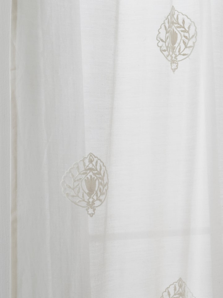 A macro detail shot of the embroidered Buti motif on the Razza Ivory Sheer Curtain, crafted with fine Kashmir-style hand embroidery techniques.