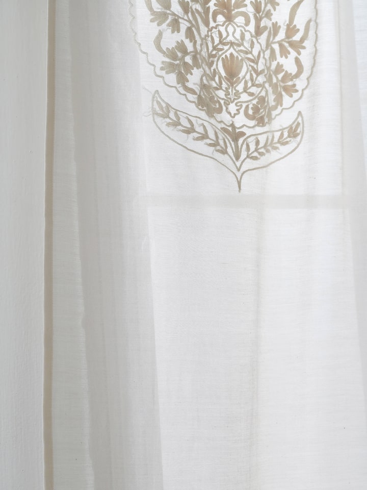 Full view of Razza ivory buta cotton silk crewel hand embroidered sheer curtain (9 ft) in a window setting