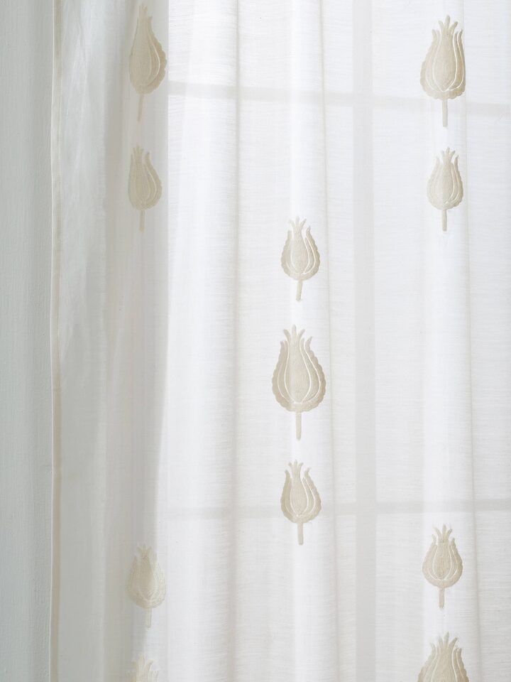 Detailed view of Razza ivory tulip buti cotton silk crewel hand embroidered sheer curtain focusing on the intricate embroidery patterns.